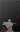silhouette of a ninja holding a sword on a dark background with red diagonal lines