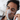 Man sleeping with a CPAP mask for sleep apnea therapy while lying in bed.